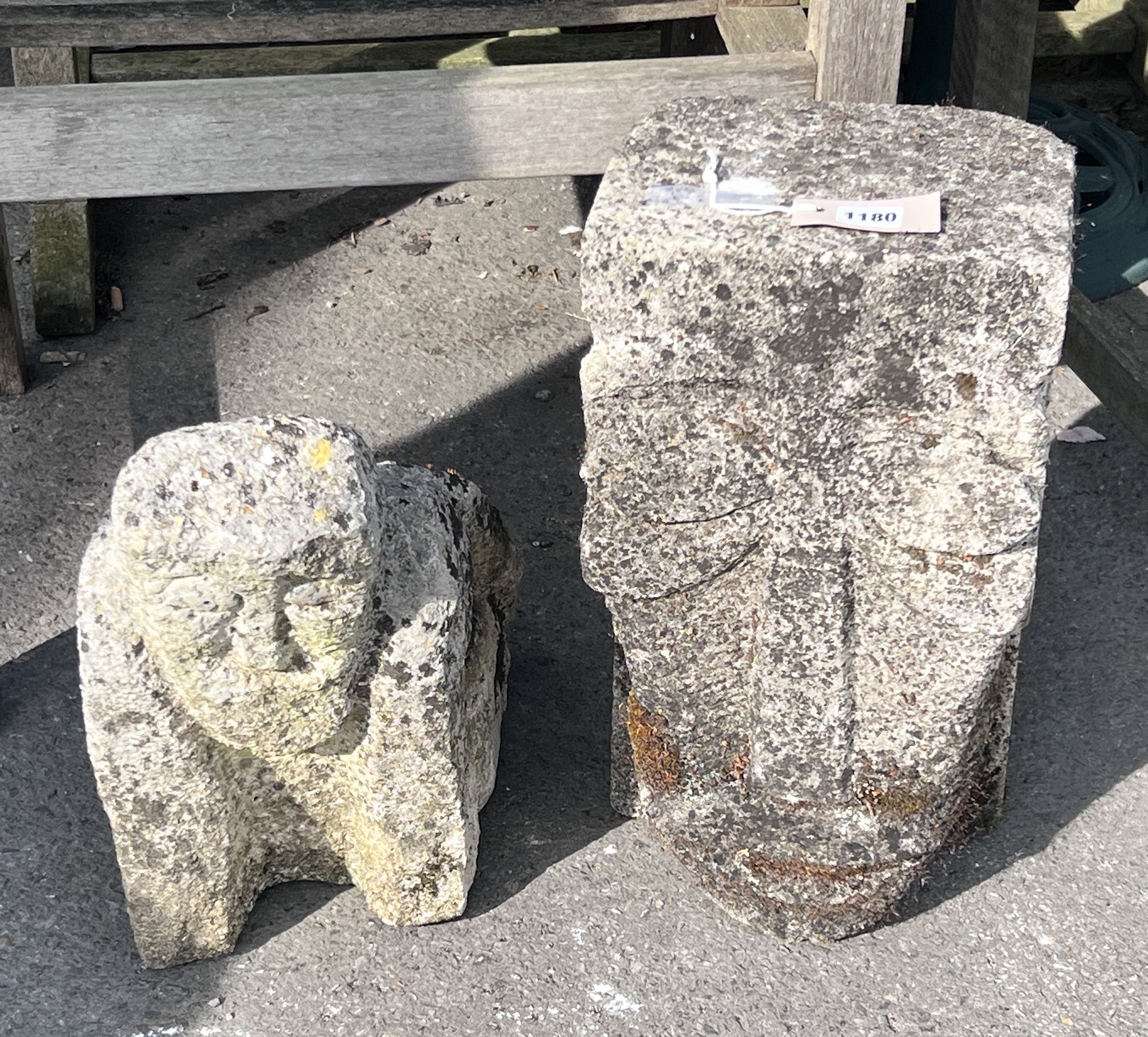 An 'Inca' carved stone head and another of a crouching figure, tallest 43cm